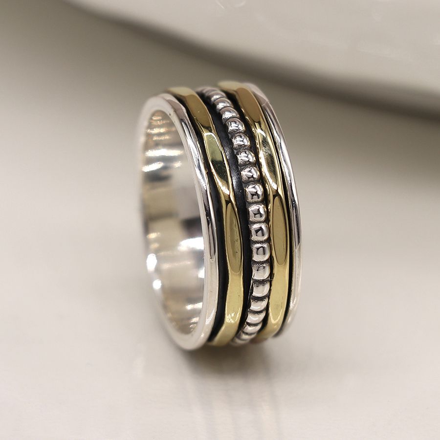 Sterling silver spinning ring with brass