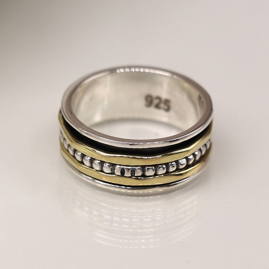 Sterling silver spinning ring with brass
