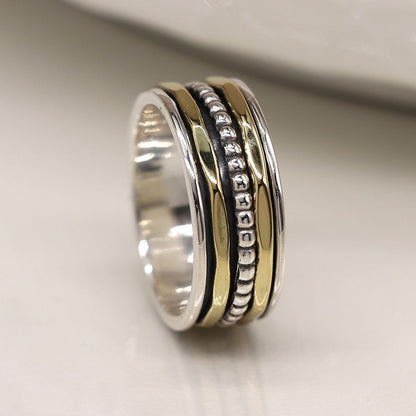 Sterling silver spinning ring with brass